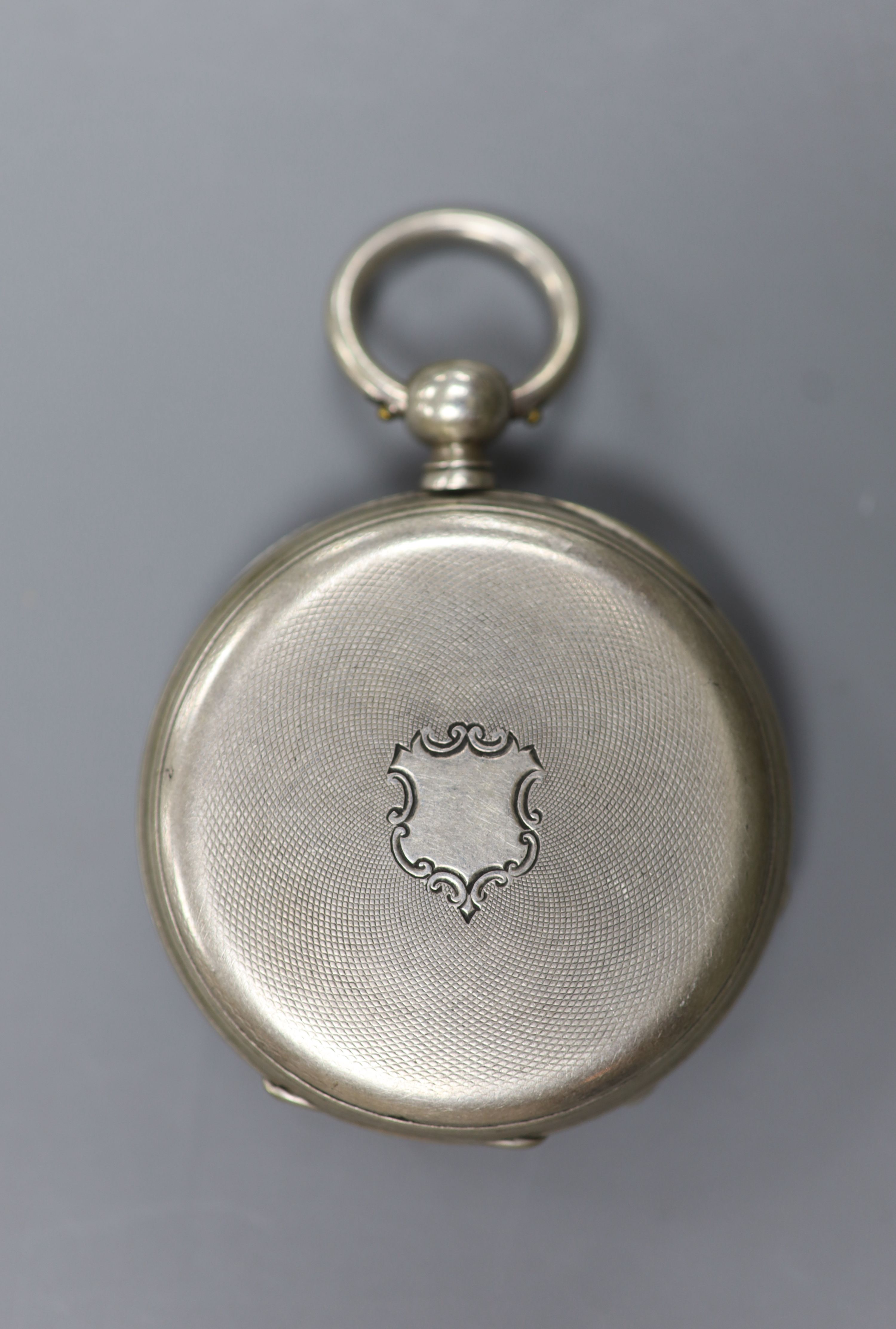 A continental engine turned white metal open face keywind pocket watch